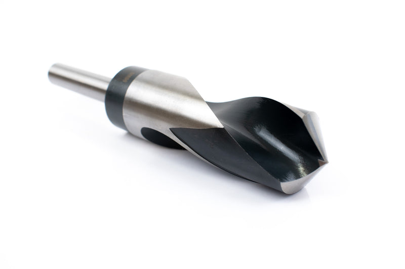 Angled view of a 1-3/16" HSS reduced shank drill bit, focusing on the sharp drill point and shank.