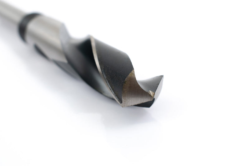 Close-up of the drill point on a 49/64" HSS reduced shank drill bit, showcasing its precision tip